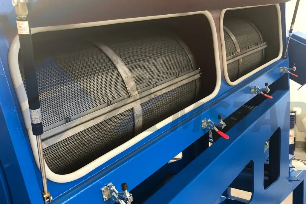 Close-up of the friction washer’s cylindrical mesh screens and door clamps