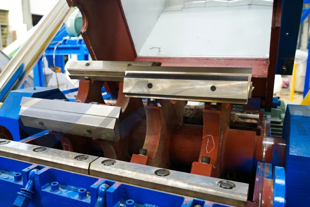 Plastic granulator cutting chamber open, showing rotor and stationary knives