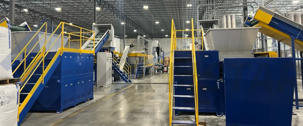 Installed PE film washing line – debaler, float sink tanks and conveyors in a large plant