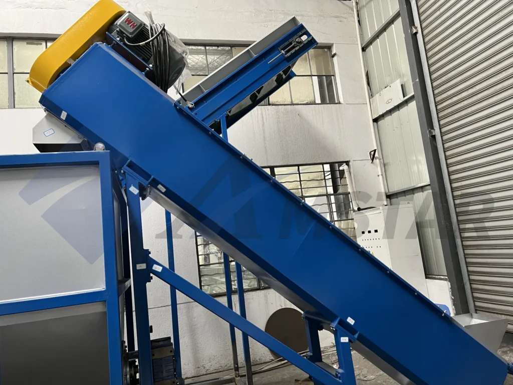 Friction screw washer with its yellow drive motor at the top of the inclined blue frame