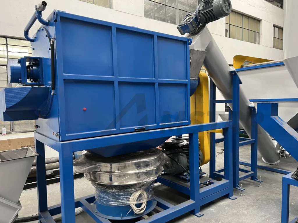 High speed friction washer with blue housing, drive motor and inclined feed screw