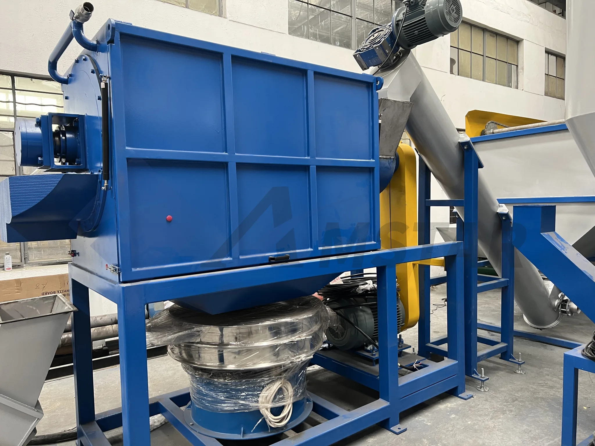 High speed friction washer with blue housing, drive motor and inclined feed screw